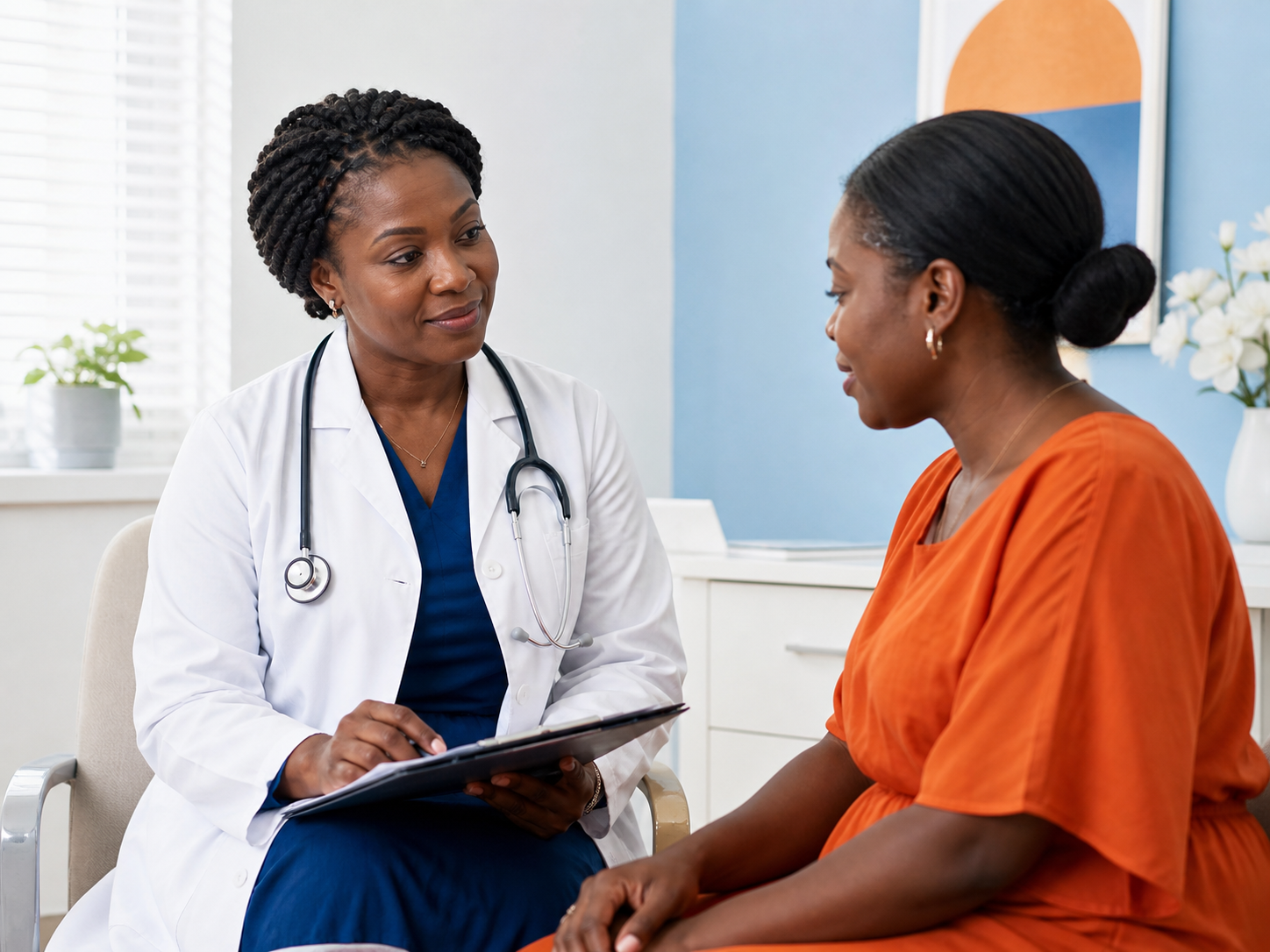 Women’s health clinician speaking with a patient in a private consultation room
